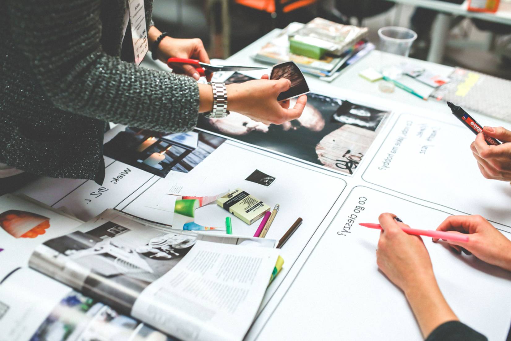 hands hovering over business materials